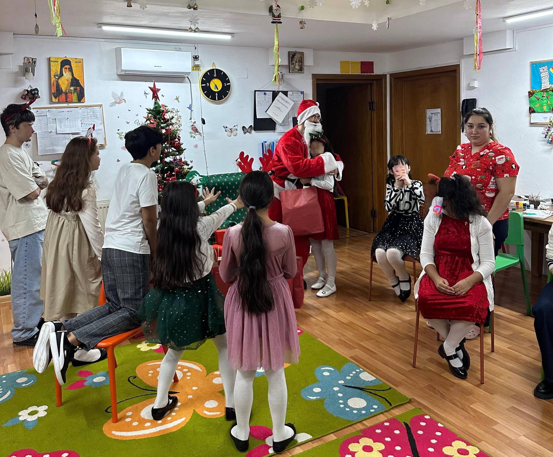 Santa gave the gifts to the kids. 